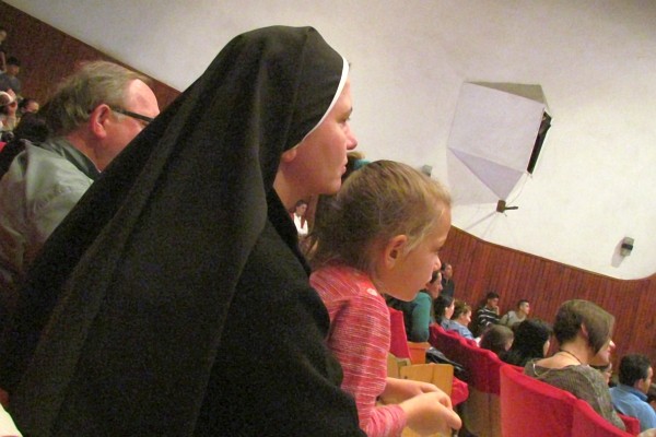 a teaching nun comforts a young student