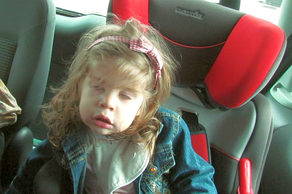 Sofia nearly asleep in her car seat