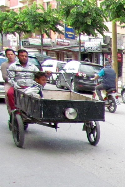 motorcycle cart with boy in the cart