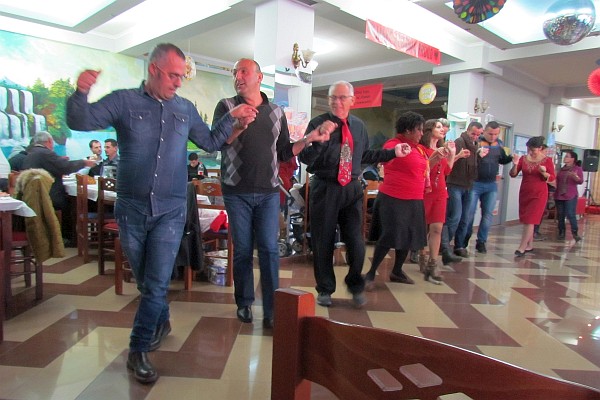 a group of persons do an Albanian dancce