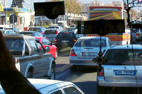 on the bus as it enters the busy streets of Tirana