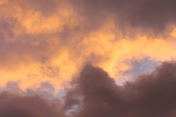 purple and orange highlight the clouds as the sun set