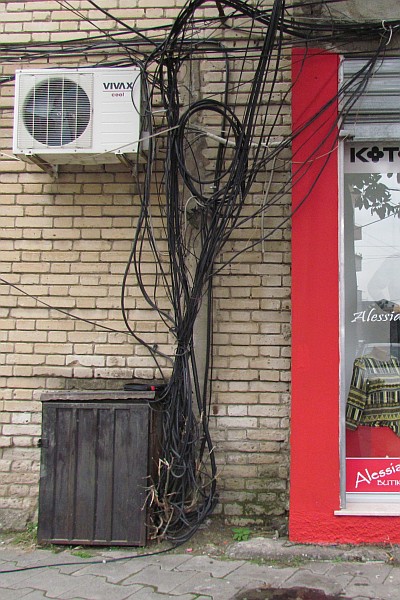 bundle of wires on an outside wall