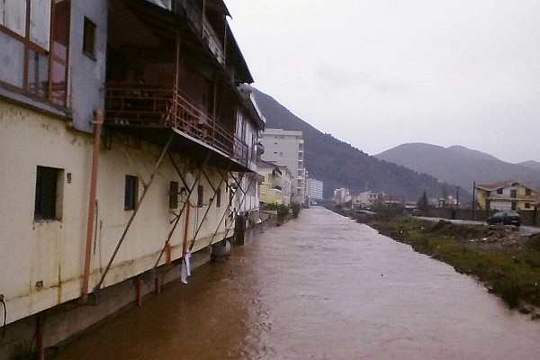 the Drini River near the market runs high after a lot of rain