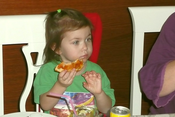 Esther eats herr pizza