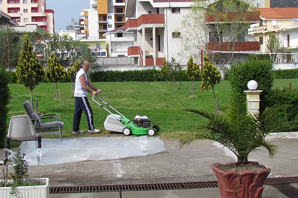 Dini mowing the school lawn