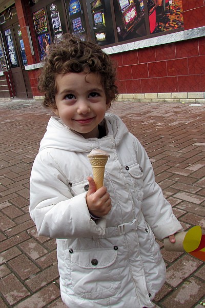 a little girl with an icecream cone