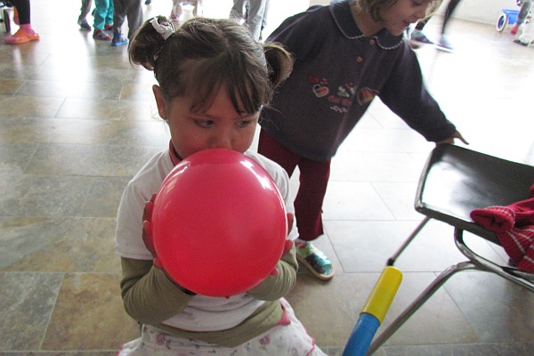 girl playing with a balloon