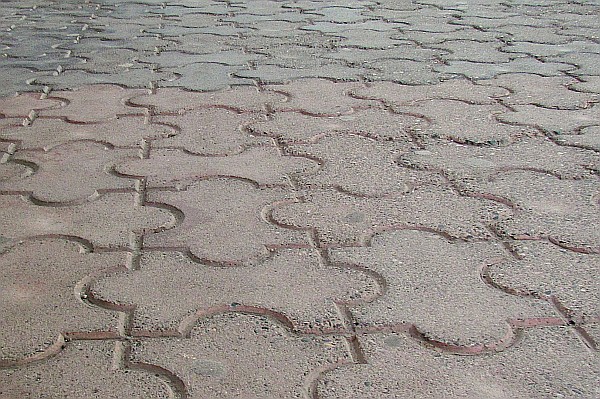 interlocking concrete tiles make up some sidewalks (I)
