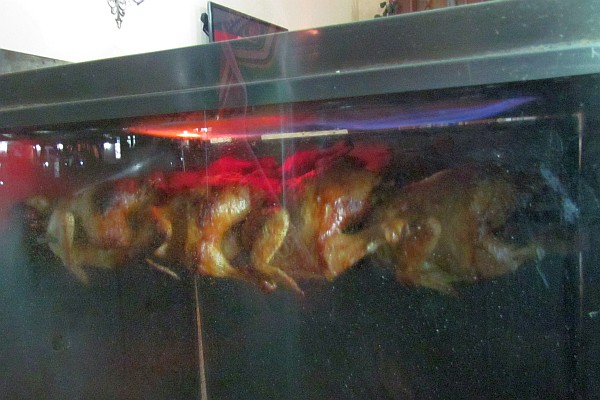 the chicken roasting on the rotisserie 
