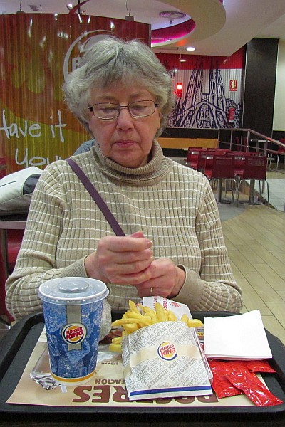 Elsie readies her straw for her soft drink at Burger King