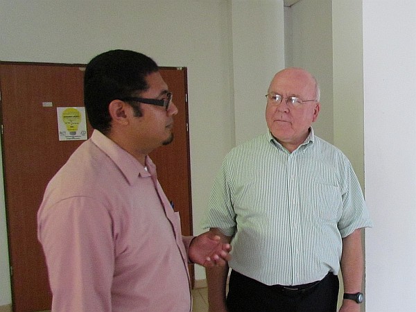 Dr.  Joaquin Urbina, dean of science, talks with Richard
