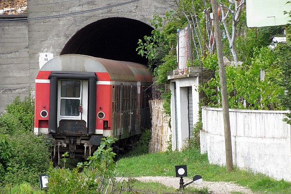 the last train car enters the tunnel
