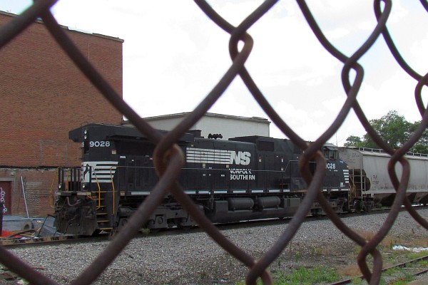 NS 9028 seen through chain-link fence