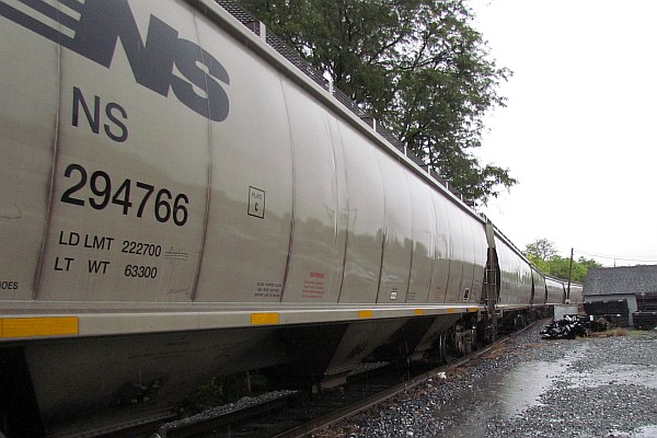 a line of grain cars waiting to be moved