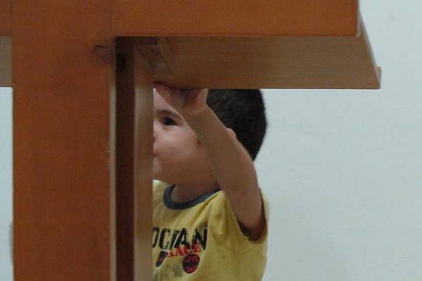 pastor's son plays peek-a-boo around leturn