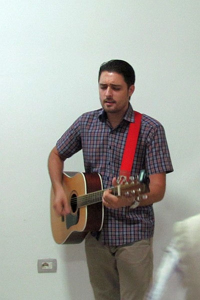 Pastor Rafael Tautari plays his guitar