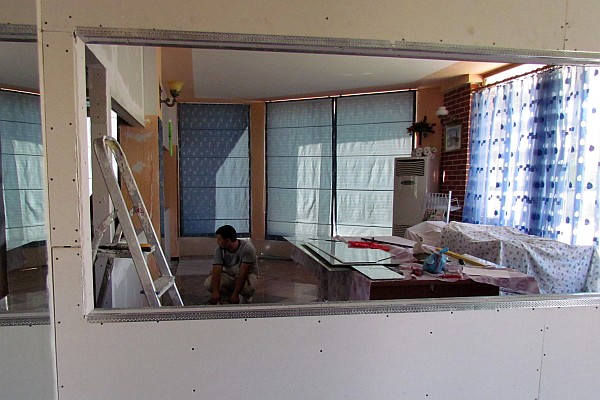 men working on adding a teachers room to the first floor of LAC