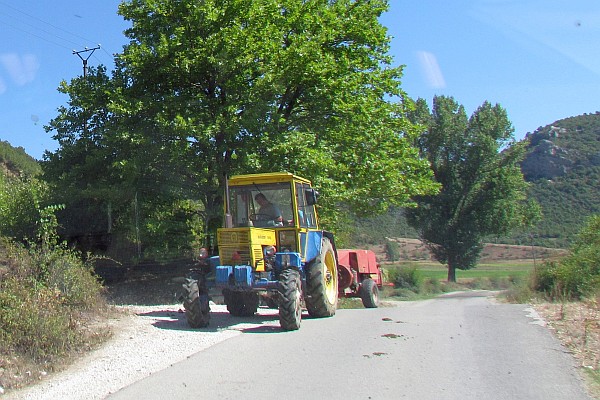 a tractor and baler