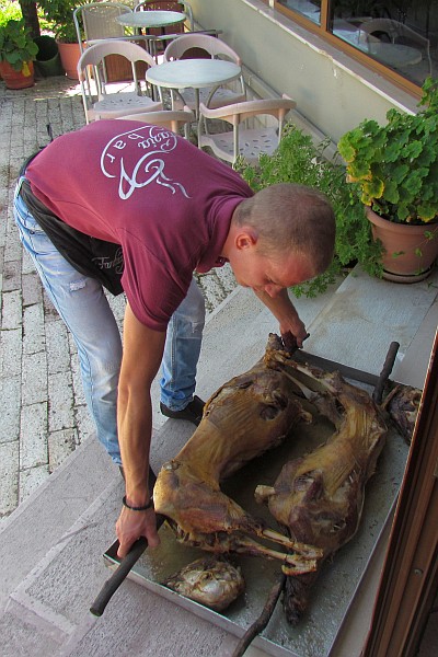 two roasted lamb carcasses are brought to the restqaurant we sat at