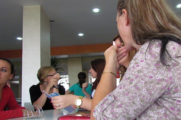 Katrina Schmid talks with other teachers at lunch