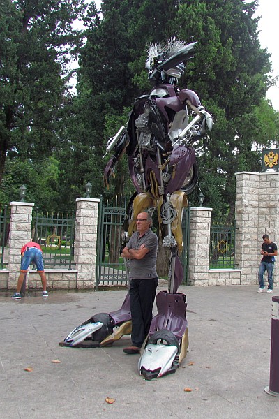 a transformer statue hugs Dini