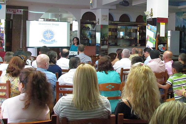 many parenbts attending an evening orientation meeting