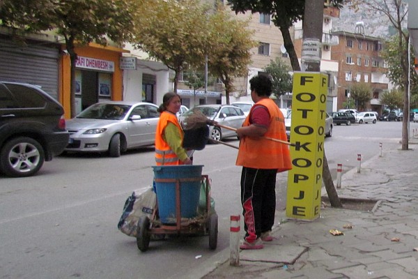 street cleaners work on street gutter near our apartment