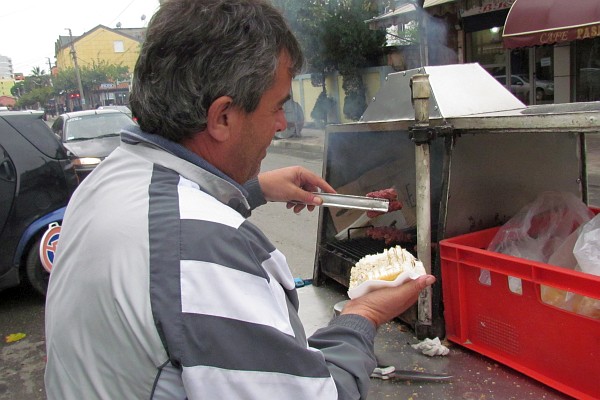 I'm watching my qofta sandwich being put together from a street vendor