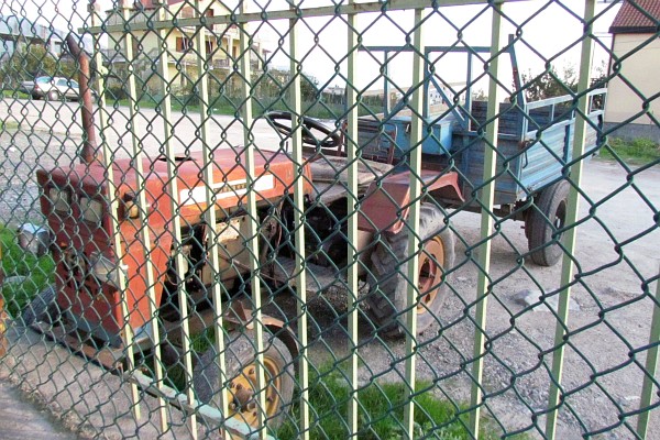 an old Chinese-made tractor and wagon