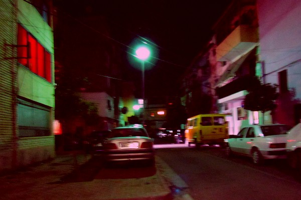 night-time scene with cars on the sidewalk for the night