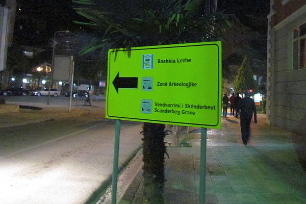 a new road sign pointing to some historical points of interest