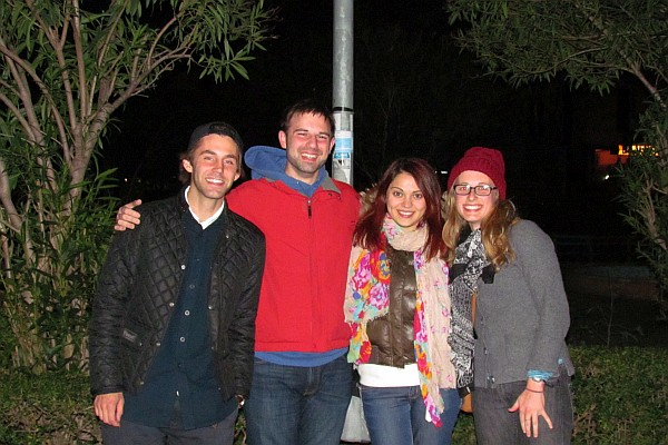 the teachers pose outside of the chicken restaurant