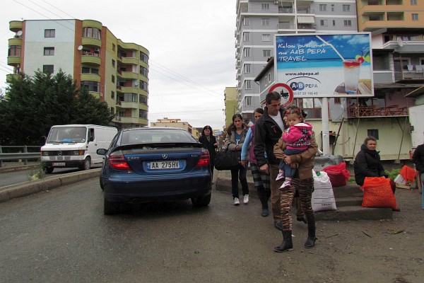 getting ready to cross the busy bridge by the market