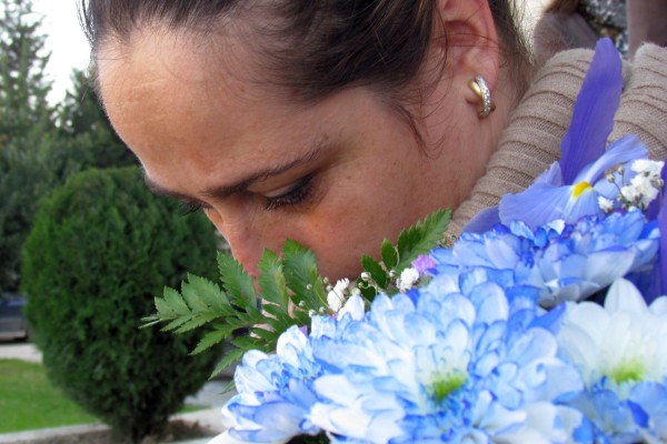 Bardha smells the flowers while we gather for a group photo
