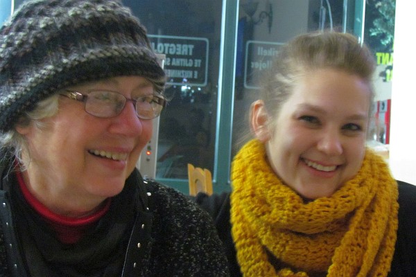 Elsie and Melanie stand together in the cold