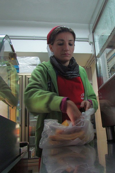 woman packs the byrek I ordered