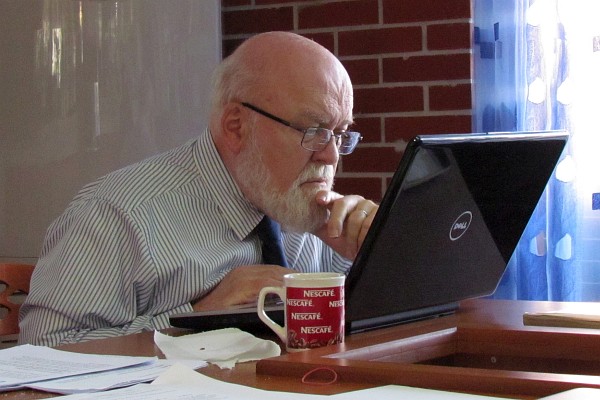 I am concentrating on my work on the coomputer in the teachers' room