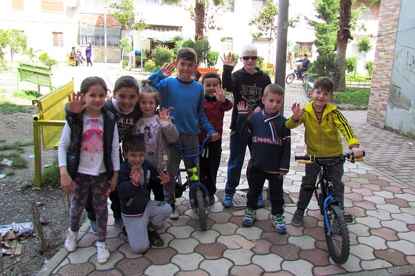 a large group of kids in the neighborhood wanted their picture taken
