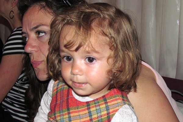 Mia on her mother's lap