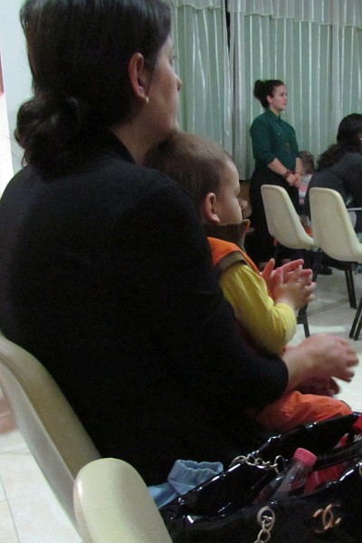 Mateo claps in time with the singing