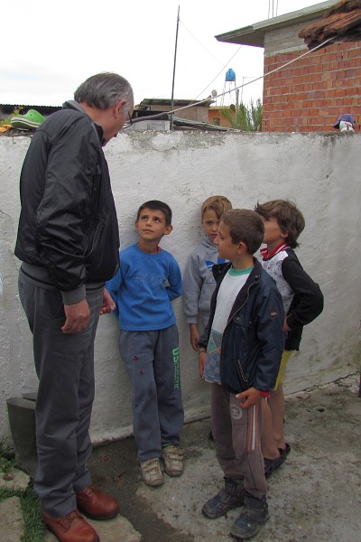 Dini makes quick friends with some young boys in the community