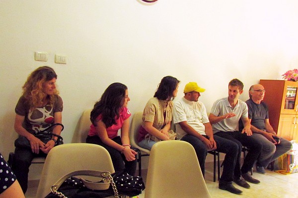 young people listen to Josh tell a story