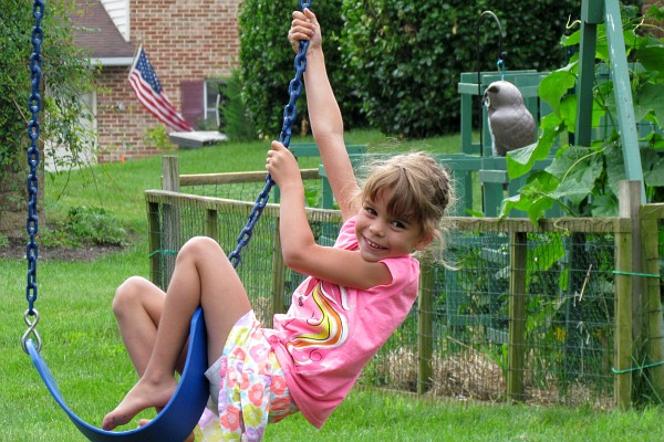Naomi swings at her home