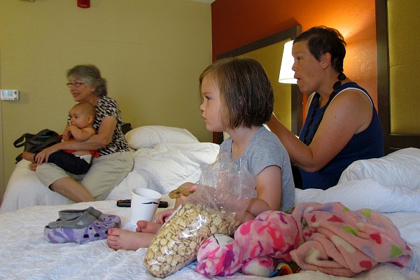 everyone watches a kid's cartoon back in the hotel room