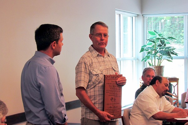 Allen Umble holding his plaque