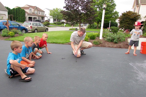 our five grandsons watch Matt light a "black snake" fireworks