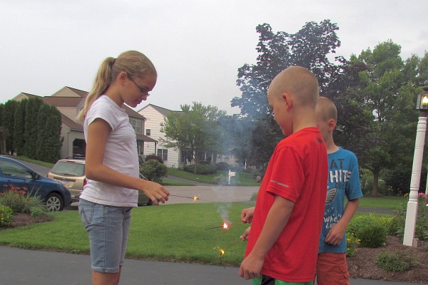 Leah, Nathan and Jared hold on to their sparklers