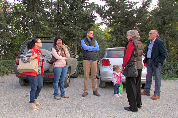 several of us wait as we get ready to leave the restaurant parking