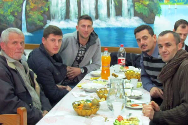 several men have finished their meals